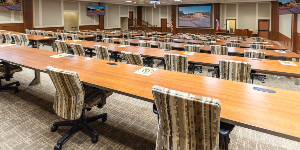 City Council Chambers feature projector with screen, audio system, PTZ cameras, video broadcast suite conference/meeting management system.