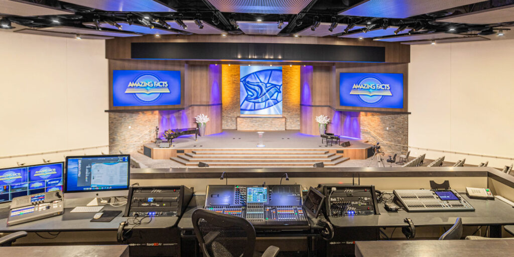 The Amazing Facts sanctuary includes line array speaker system, digital mixing consoles on a digital audio network, LED theatrical lighting, video presentation switching for IMAG, and redundant on-air video broadcast control room.