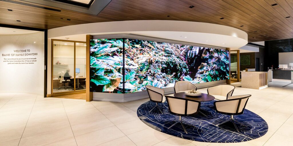 The 3mm lobby video wall spans the length of the bank’s entrance-facing wall. The Sansi display’s content rotates through bold, colorful imagery drawn from themes of a Hawaiian voyaging canoe. The 33-foot wide screen also runs bank promotions and other marketing campaigns.