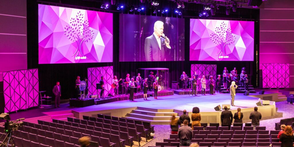 The main sanctuary features three, 24’ x 13.5’ direct view LED displays, 85” 4K confidence monitor and theatrical lighting.