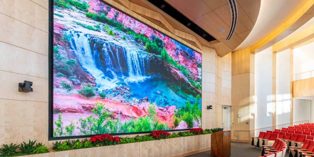 The auditorium features a 24’ x 13.5’ direct view LED video wall, 4K displays, distributed speakers, PTZ cameras and presentation system.