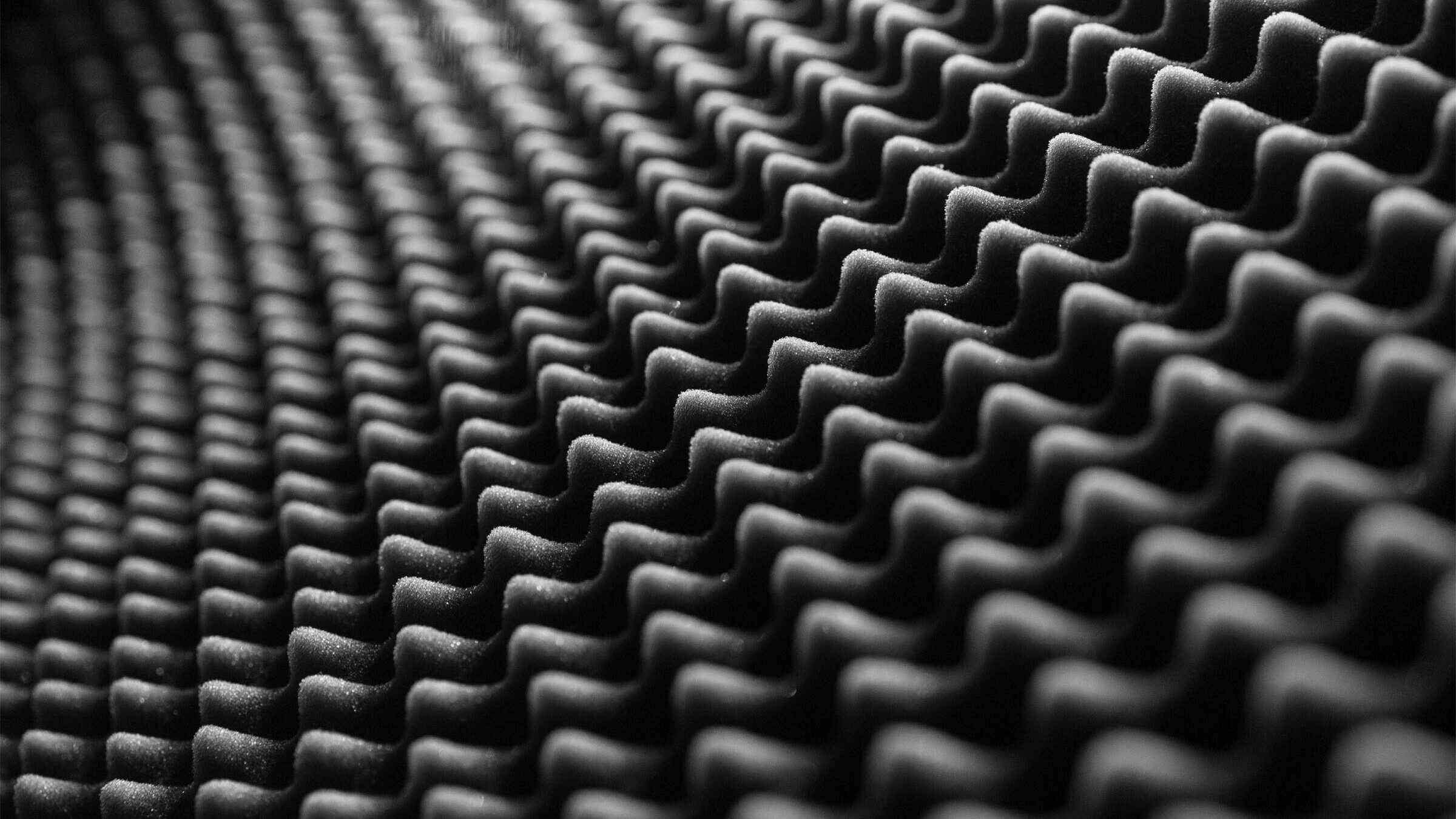 Wall padding absorbs noise to reduce background noises. These materials are often used in recording spaces.